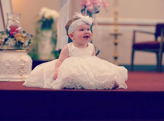 Who buys the baptism dress or gown?